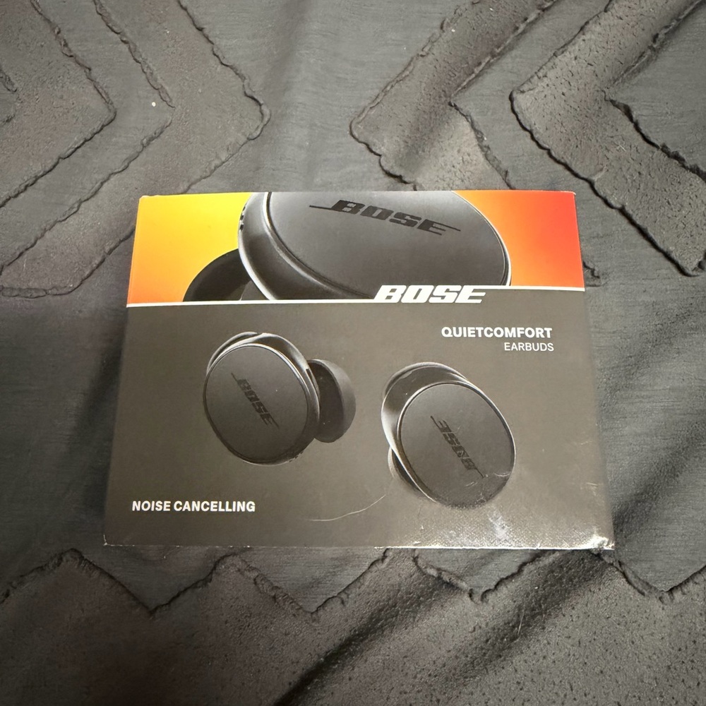 Bose Wireless Earbuds Packaging with Orange and Black Design